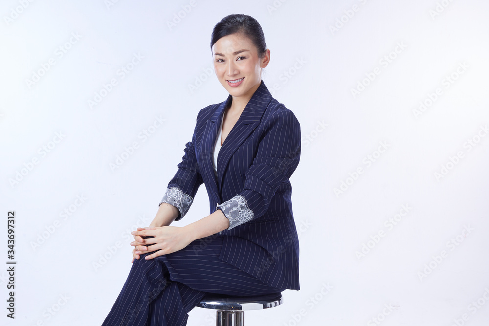 business woman is sitting on a chair. Concept business woman. business woman is sitting on a chair. Concept business woman.