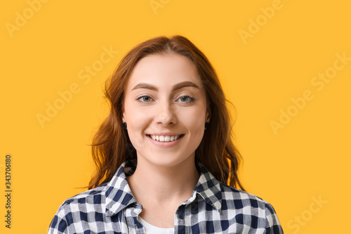 Young woman with healthy teeth on color background © Pixel-Shot