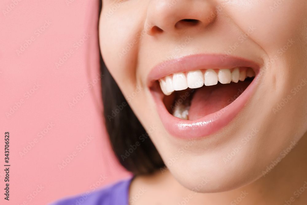 Young woman with healthy teeth on color background, closeup Young woman with healthy teeth on color background, closeup