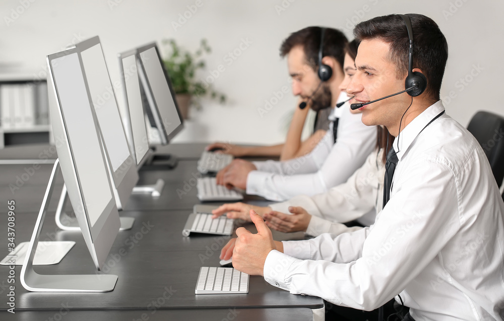 Team of technical support agents working in office Team of technical support agents working in office