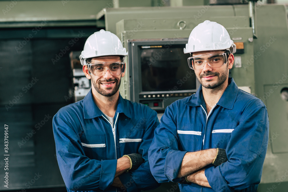 Engineering team portrait smile in heavy industry factory men working together. Arm Crossed fold with space. Engineering team portrait smile in heavy industry factory men working together. Arm Crossed fold with space.