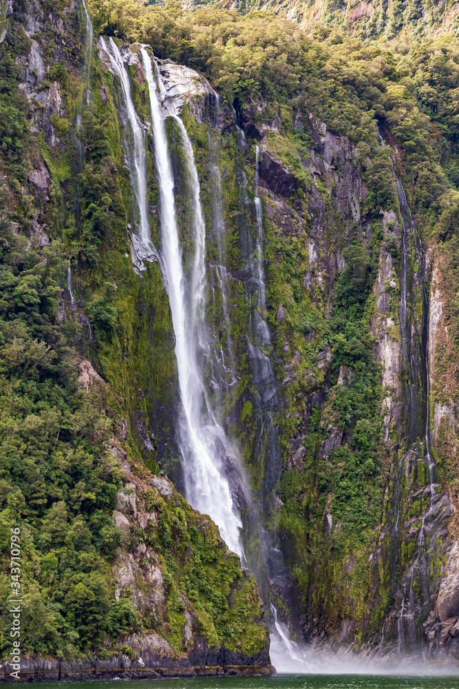 Waterfall at Milford sound  in New Zealand. South Island.