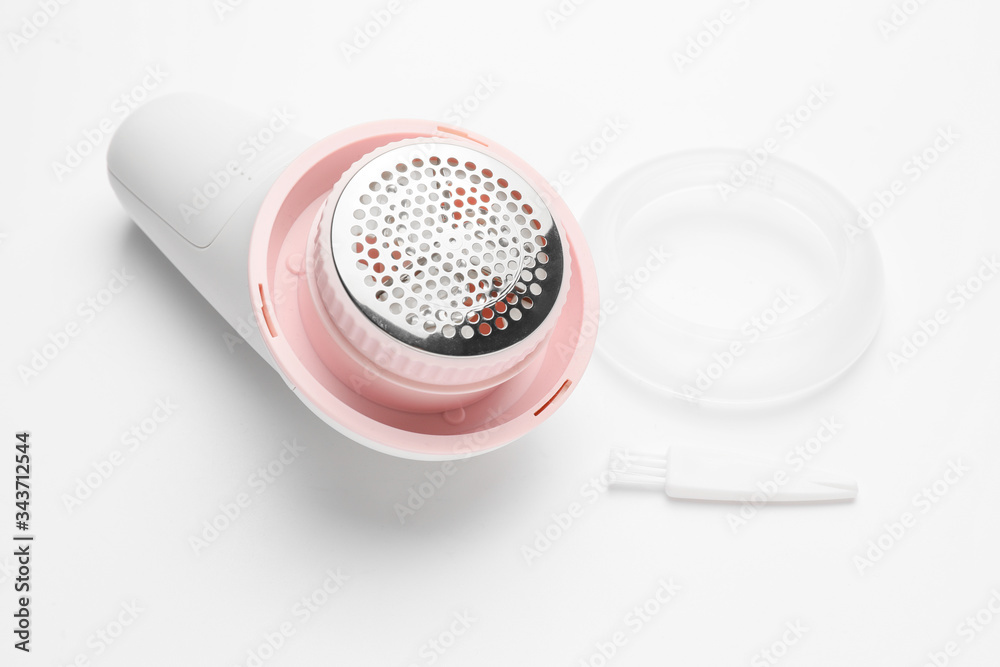 Modern fabric shaver on white background Modern fabric shaver on white background