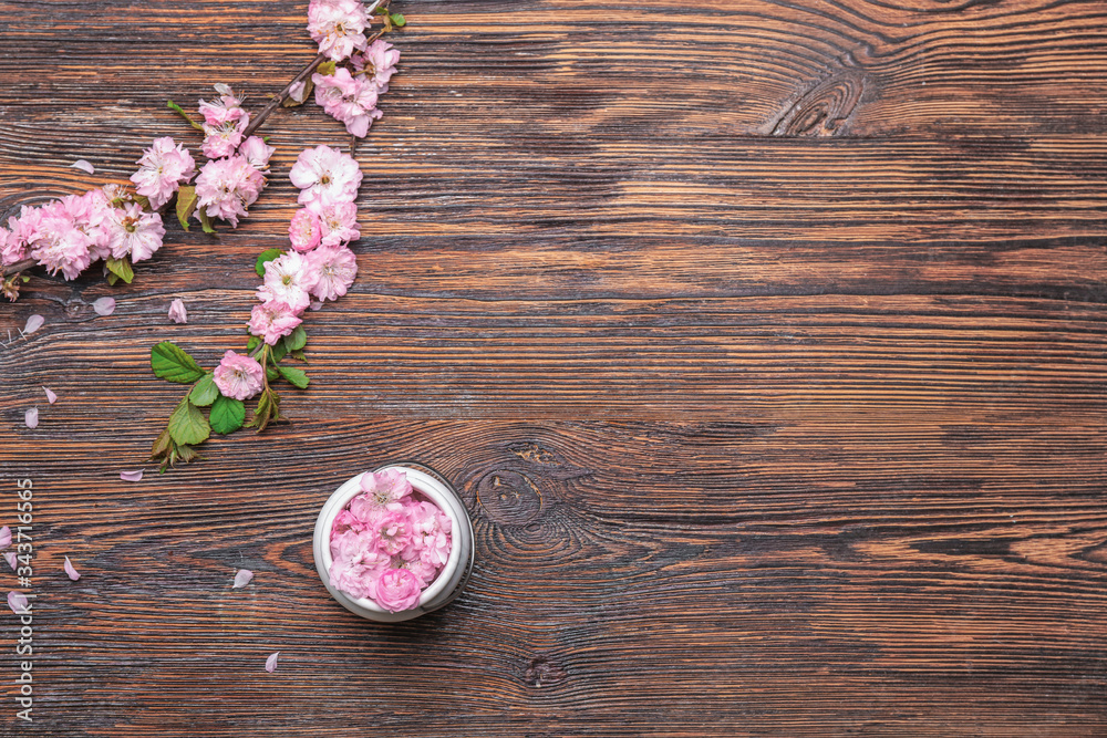 Beautiful blossoming branches on wooden background