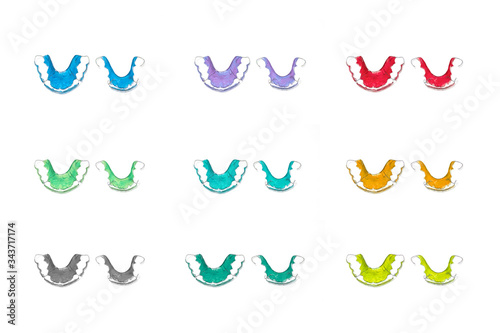 Retainer teeth, Braces,Many colors  Red color, Blue color,Yellow color,  Green color Retainer(top viwe) on a white background photo