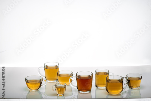 glass cups with hot tea on table, close view 
