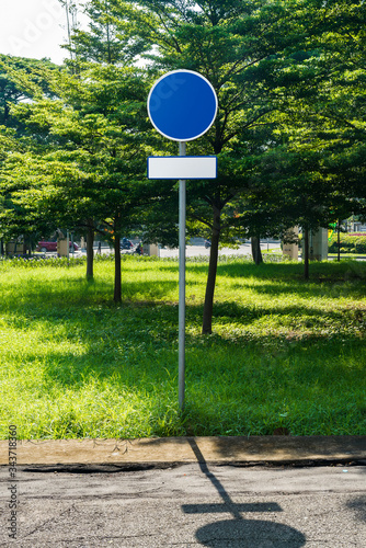 Blue blank road sign on the housing street