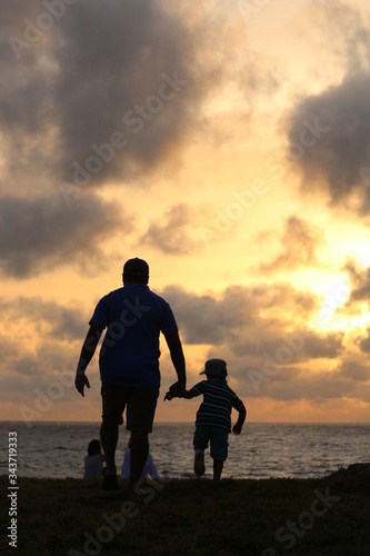 Old Dutch Fort, Galle, Sri Lanka - 06112018: Photograph of a son and father enjoying the sun set good for fathers day celebration