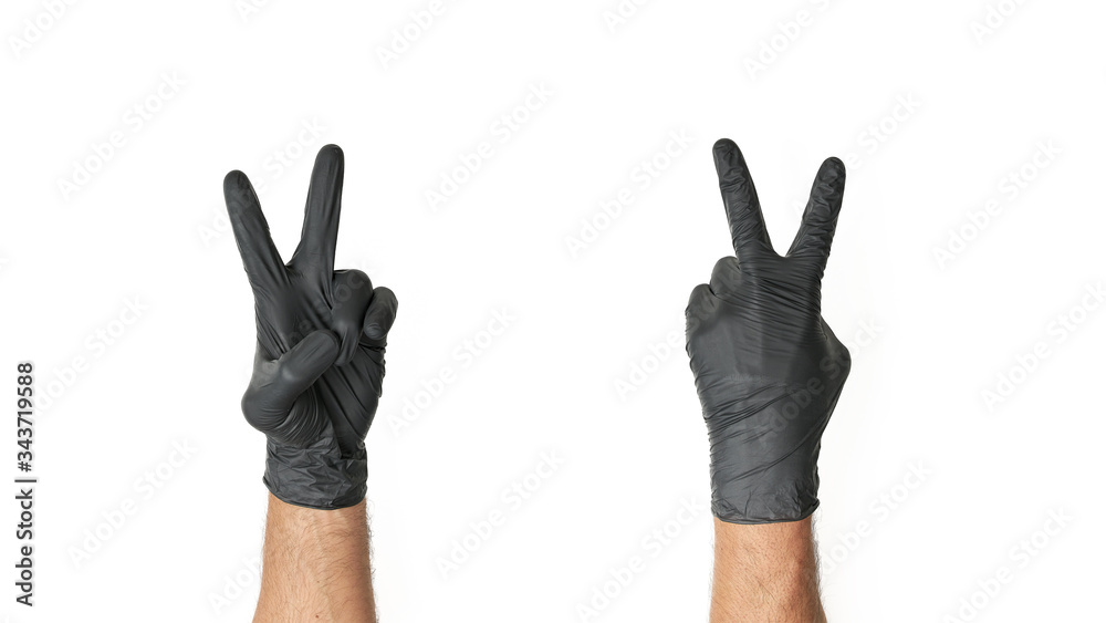 Męska dłoń w jednorazowej czarnej rękawiczce - obrazy, fototapety, plakaty 