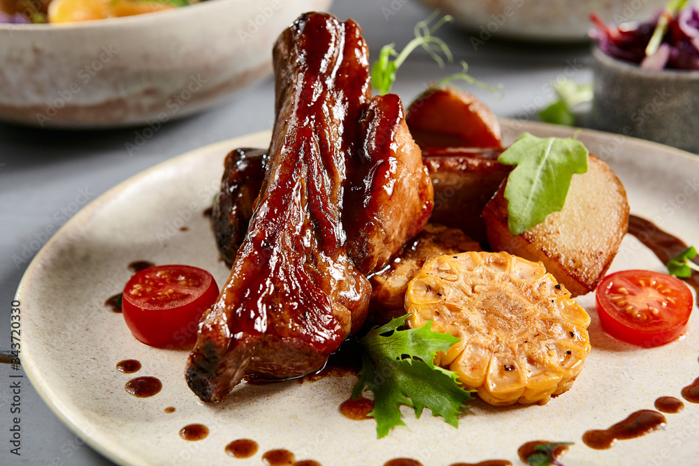 Φωτογραφία Baked ribs with homemade potatoes and coleslaw salad in white plate