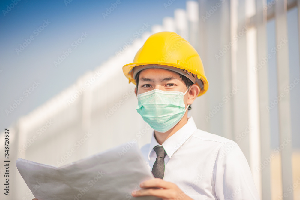 construction engineer holding blueprint working on work place construction engineer holding blueprint working on work place
