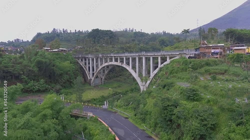 the construction of the beautiful Sigandul bridge in temanggung in central java is in front of a beautiful mountain the construction of the beautiful Sigandul bridge in temanggung in central java is in front of a beautiful mountain