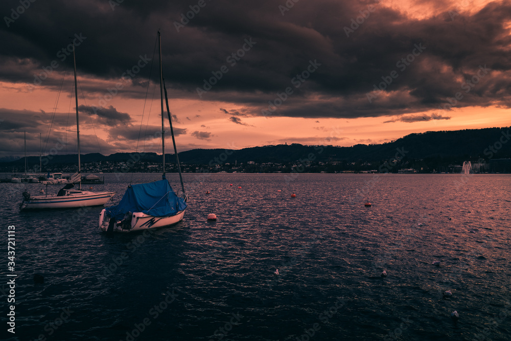 sunset in the harbor at the lake zürich in switzerland