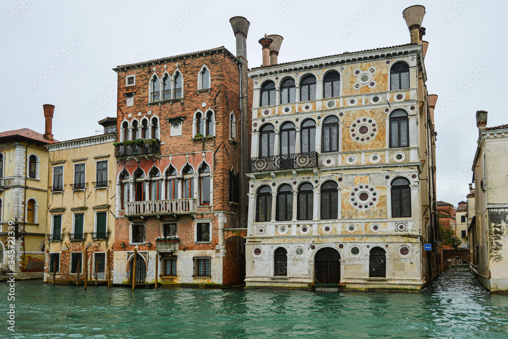View from the water to old beautiful buildings in Venice.