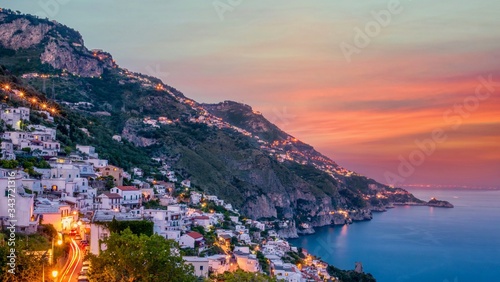 A long exposure shot of the picturesque Italian town of Praiano on the Amalfi Coast at sunset.