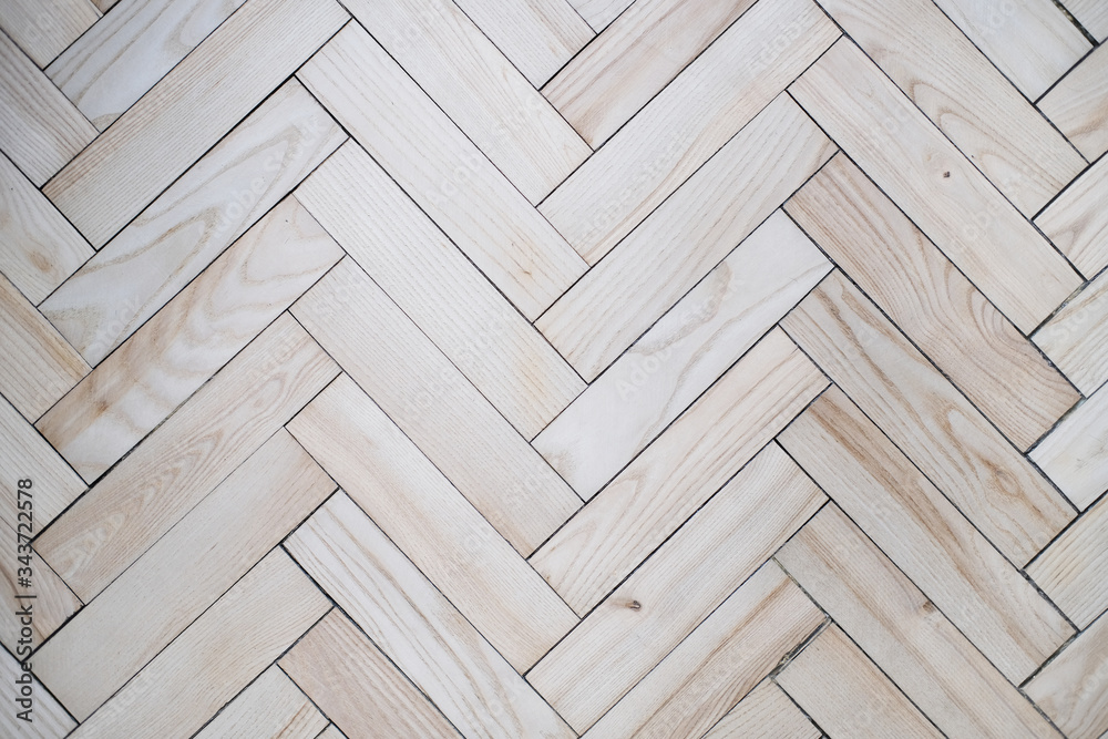Fototapeta premium Light beige parquet floor as a background