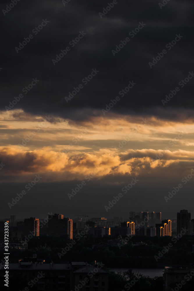 Moscow. Top view. Stormy sky with clouds and orange gaps. Big city. Industrial. View of ordinary houses in Moscow, a big city