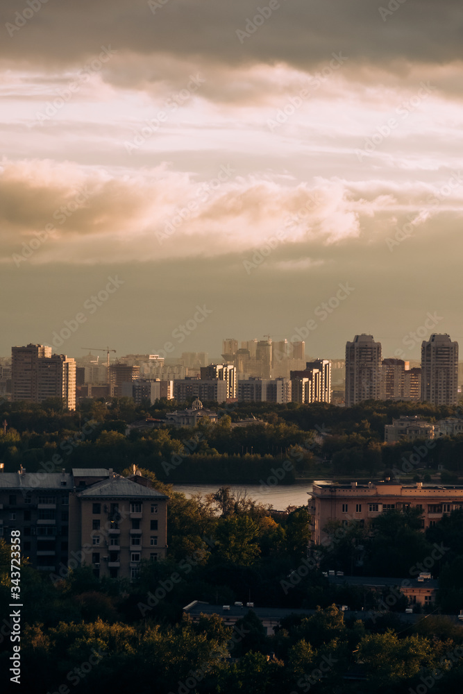 Moscow. Top view. Stormy sky with clouds and orange gaps. Big city. Industrial. View of ordinary houses in Moscow, a big city