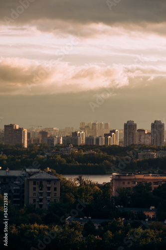 Moscow. Top view. Stormy sky with clouds and orange gaps. Big city. Industrial. View of ordinary houses in Moscow, a big city © Margarita Timofeeva