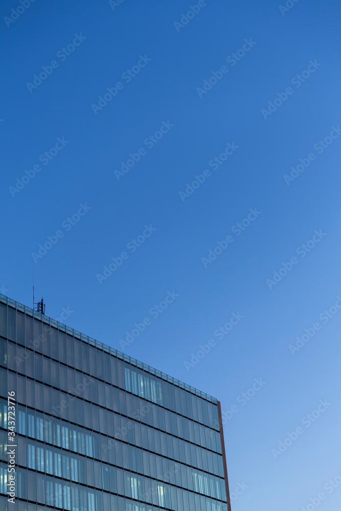 Facade of a Corporate Building during sunrise Facade of a Corporate Building during sunrise