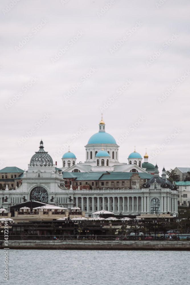 Russia. Kazan. August, 2019. Summer. View of the river and the city center. Russian cityscape with a church and ancient buildings. View of the Kremlin.