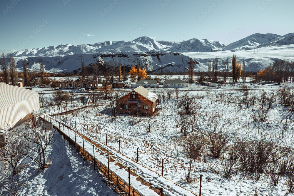 Obraz premium Beautiful village in a mountain valley near the lake. Mountains landscape and old town. Travel - Dagestan