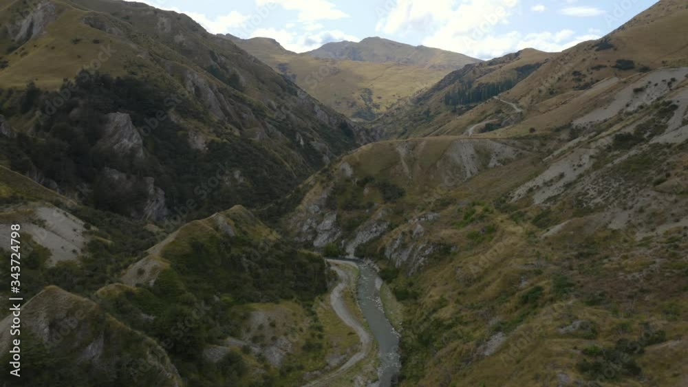 Southern Alps Mountains, Winding River, Green Hills on Cloudy Afternoon, Aerial Southern Alps Mountains, Winding River, Green Hills on Cloudy Afternoon, Aerial