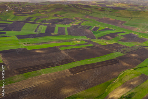 Empty agricultural hills in spring. Seasonal work concept image.   photo