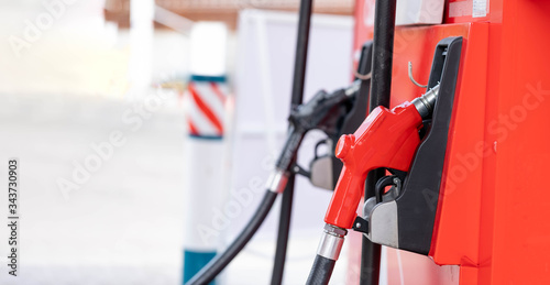 Wallpaper Mural Close-up hands refueling in car,The petrol station staff is refilling the car for customers,Refill fuel in car at gas station,Focus hands refilling. Torontodigital.ca