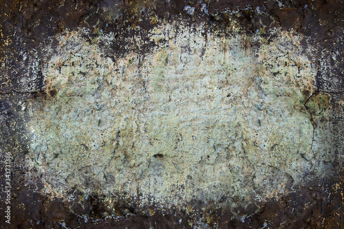 Grunge wall texture background. Paint cracking off dark wall with rust underneath. Copy Space.