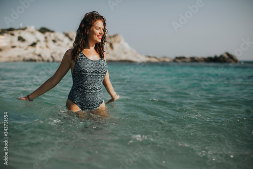 Young woman walking in the ...
