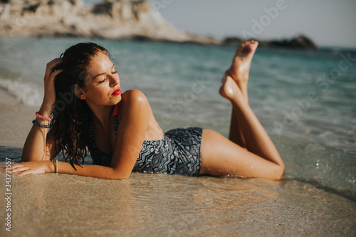 Young woman wearing bikini ...