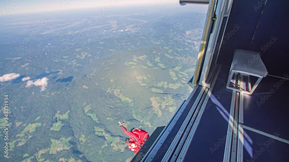 Instructor and student skydivers jump out airplane. Tandem jump, adrenalin rush