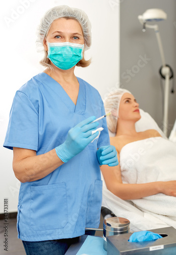 Professional cosmetologist preparing to perform procedures in modern cosmetology office