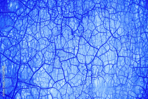 Cracked surface, abstract blue background