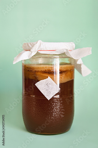 Close up of a jar with kombucha tea fermenting