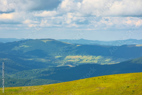 alpine scenery of carpathian mountains. stunning views on a windy summer day. clouds on the sky. ridges and valleys in the distance