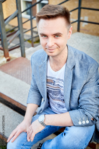 Kirov, Russia - September 04, 2019: Portrait of a handsome fun man outdoors in the city