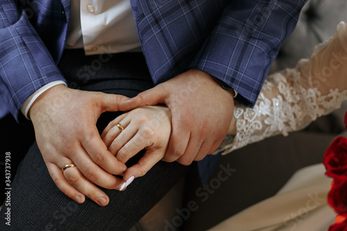 Fototapeta Naklejka Na Ścianę i Meble -  bride and groom holding hands