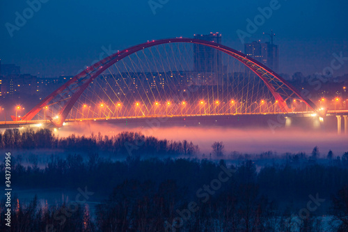 Illumination of Bugrinskiy bridge in winter, Novosibirsk, Siberia