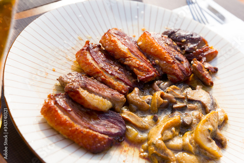 Fried duck breast Magre served with mushrooms