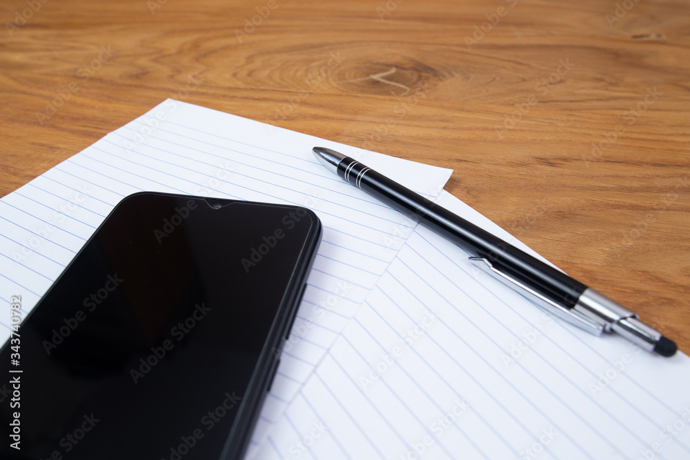 Phone, notes and pen close up, creative writing Phone, notes and pen close up, creative writing