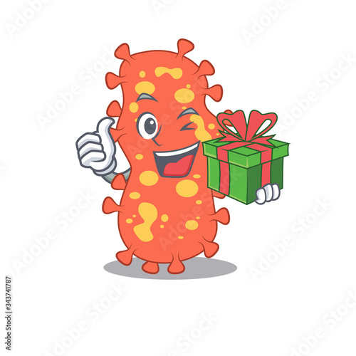 Smiling bacteroides cartoon character having a green gift box