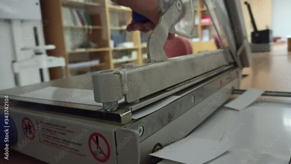 paper cut with old technic manual paper cutter
