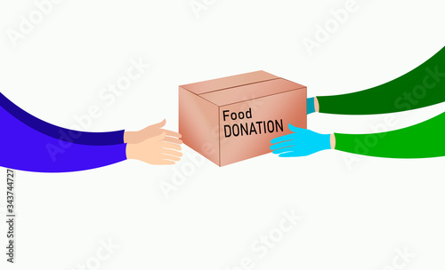 Volunteers with a box of donations with food passes the box into the hands of a person