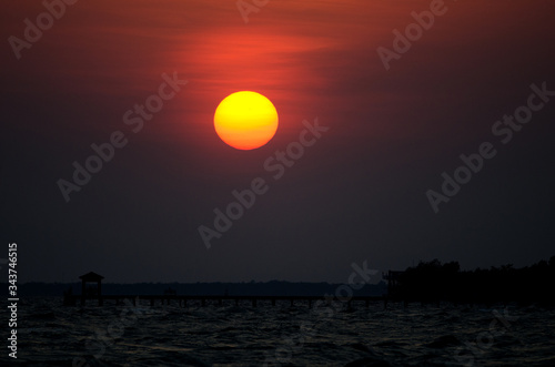 silhouette dock on ocean sea vanilla sky