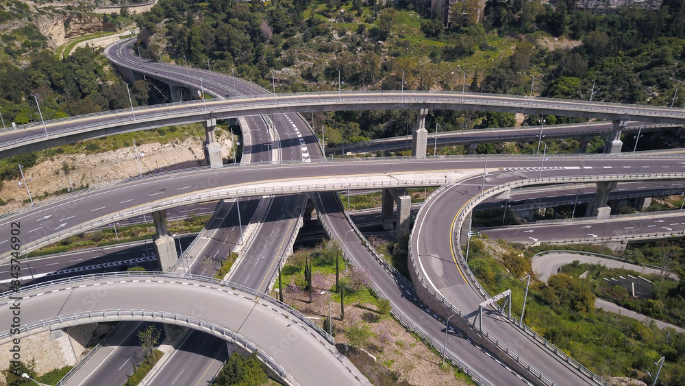 Obraz premium Aerial view of highway road, interchange and overpass in city.