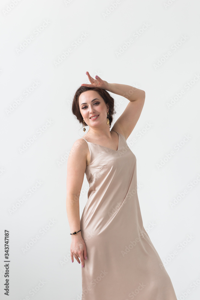 Latina dance, strip dance, contemporary and bachata lady concept - Woman dancing improvisation on a white background Latina dance, strip dance, contemporary and bachata lady concept - Woman dancing improvisation on a white background