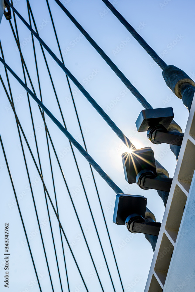 Naklejka premium Tightened cable threaded connections in the fastening of the bridge structure in sunlight