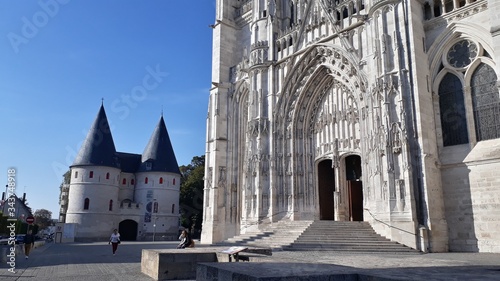 cathedral entrance and small castle in the background photo